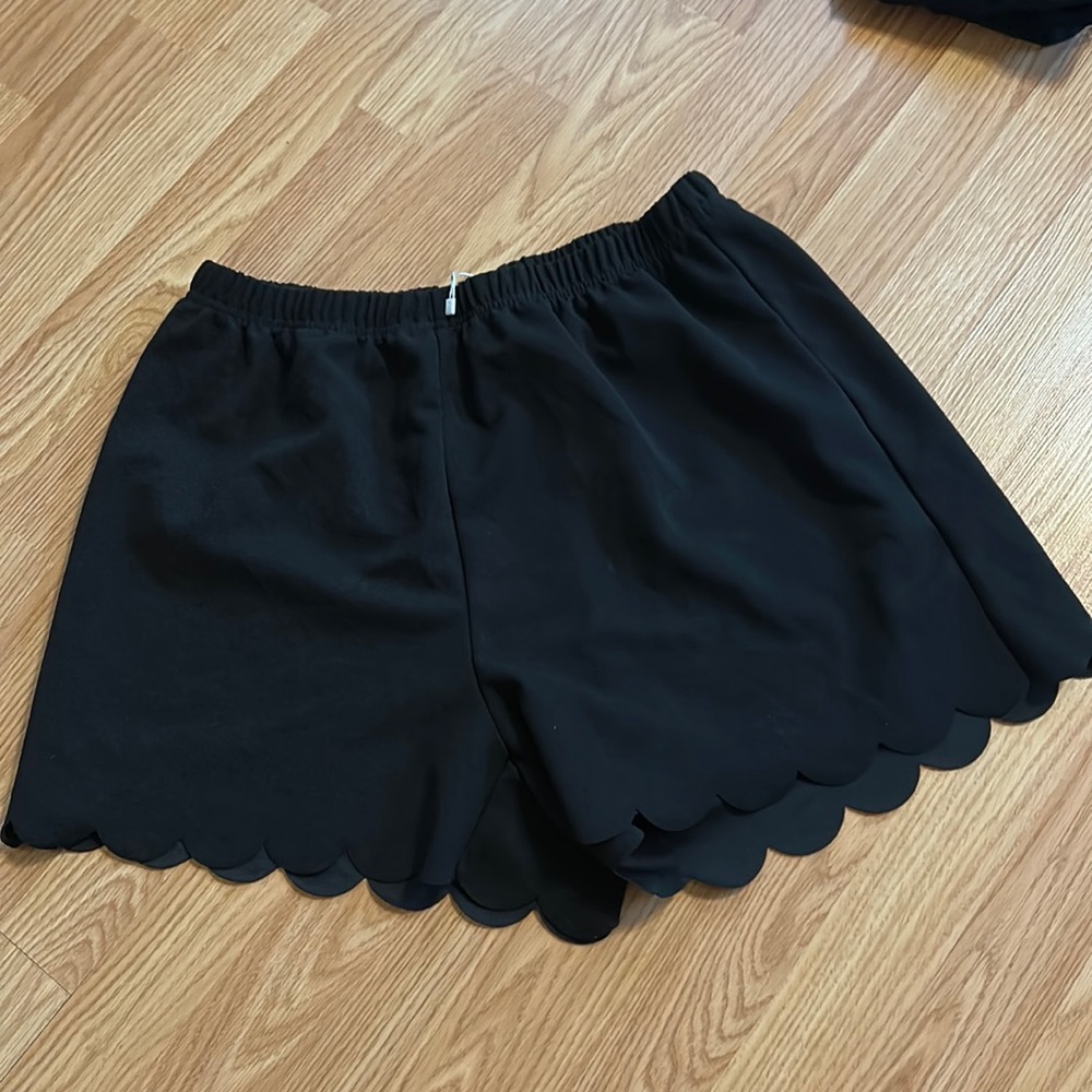 Women’s XL Emery Rose ruffle shirts.